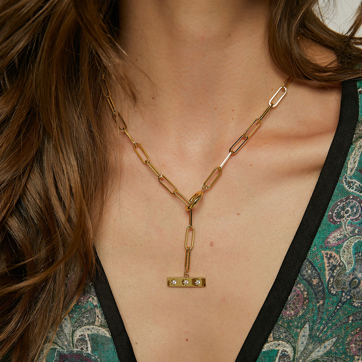model wearing the gold plated zirconia bar toggle necklace