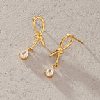 Pair of knotted loop studs on a textured surface