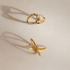 Gold tone open-loop and crossed-band rhinestone rings