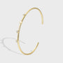 gold plated zirconia station open cuff bracelet