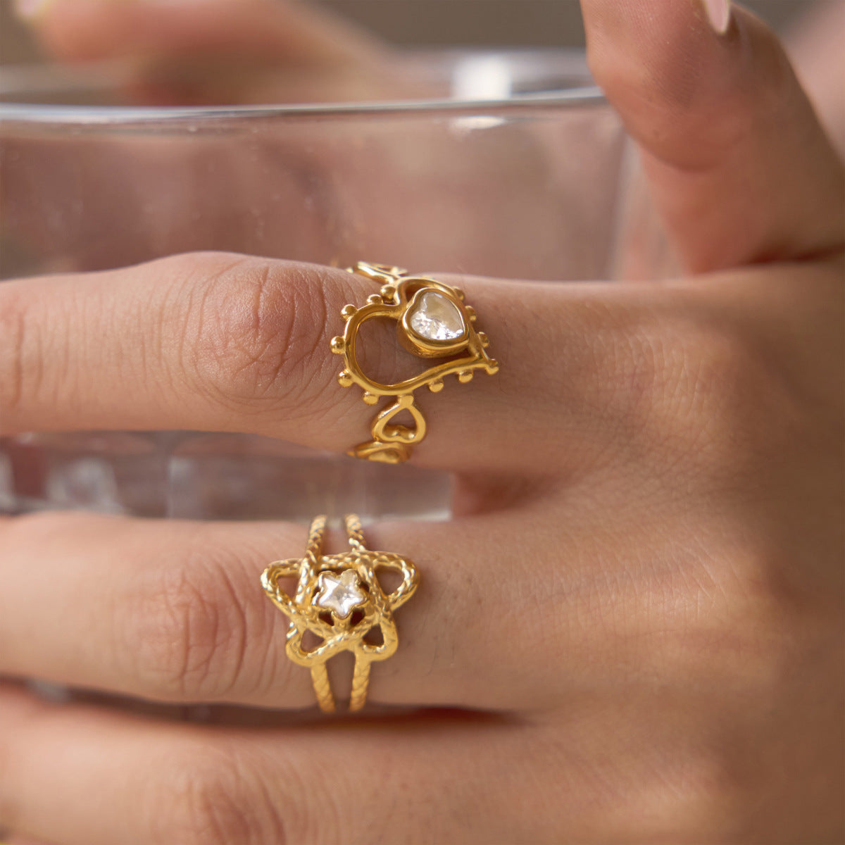 Heart and star accent rings worn on fingers