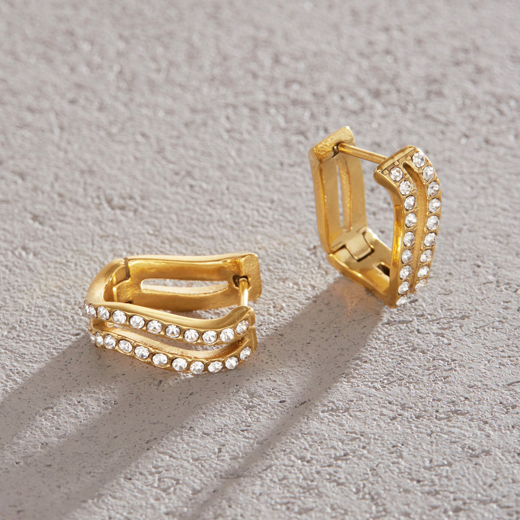 Wave earrings laid at different angles