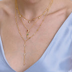 gold plated red rose pendant necklace worn in a layered look