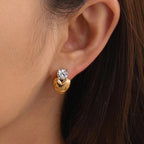 close worn view of the polished heart and round clear-stone studs