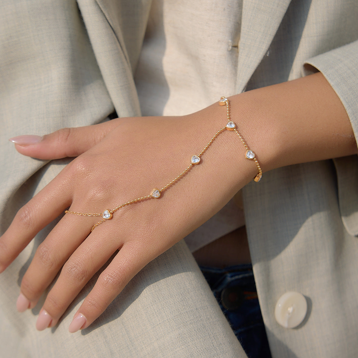 Fine hand chain worn with a light jacket