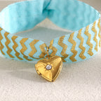 Blue Fabric Tie Bracelet with Gold Plated Stainless Steel Heart Locket — worn view