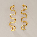 Pair of gold tone serpentine wave earrings