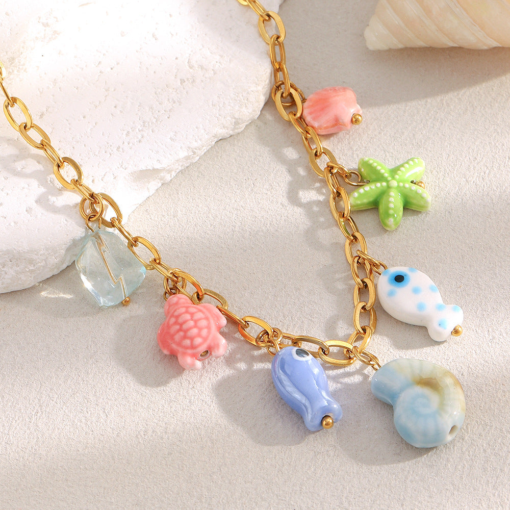 gold plated multicolor ocean charm necklace with ceramic and resin details