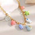 gold plated multicolor ocean charm necklace with ceramic and resin details