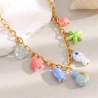 gold plated multicolor ocean charm necklace with ceramic and resin details
