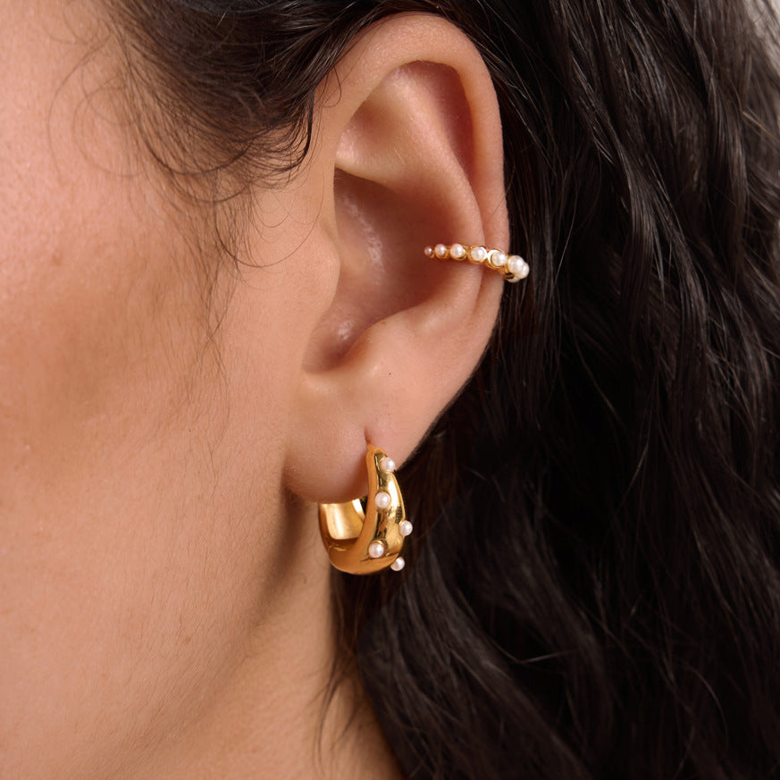 White pearl accent hoop styled with a small beaded cuff