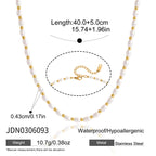 Small white bead strand with gold tone spacers and dimensions