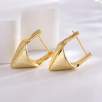 side view of polished pyramid huggie earrings and hinged closures
