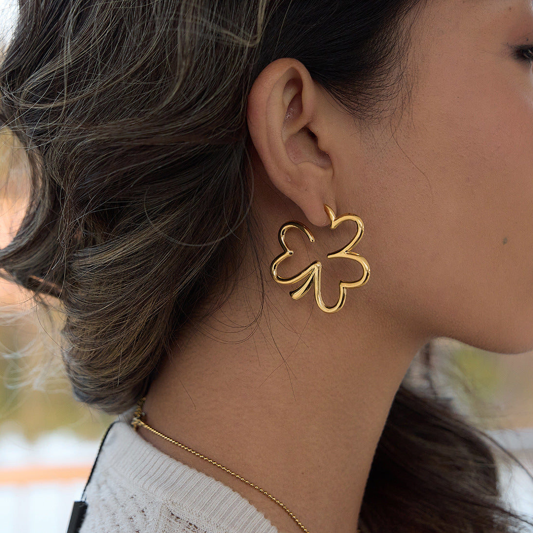 open four-leaf clover statement earrings in side profile