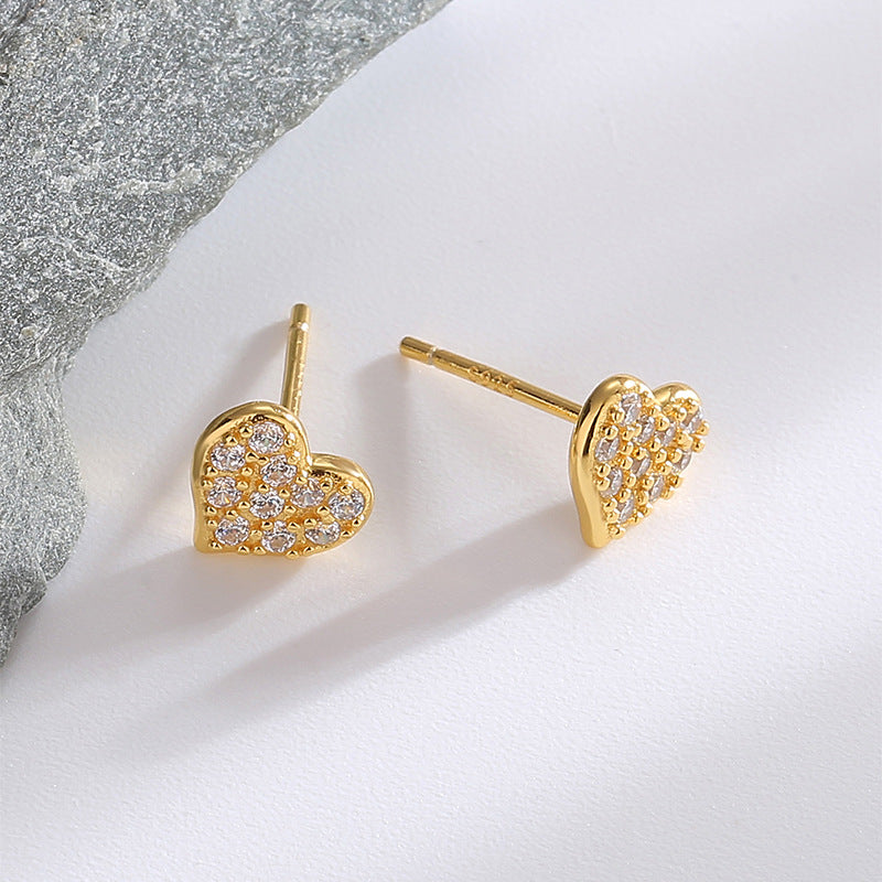 front and side views of compact clear zirconia heart studs