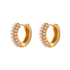 isolated front view of layered pearl-trimmed huggie earrings