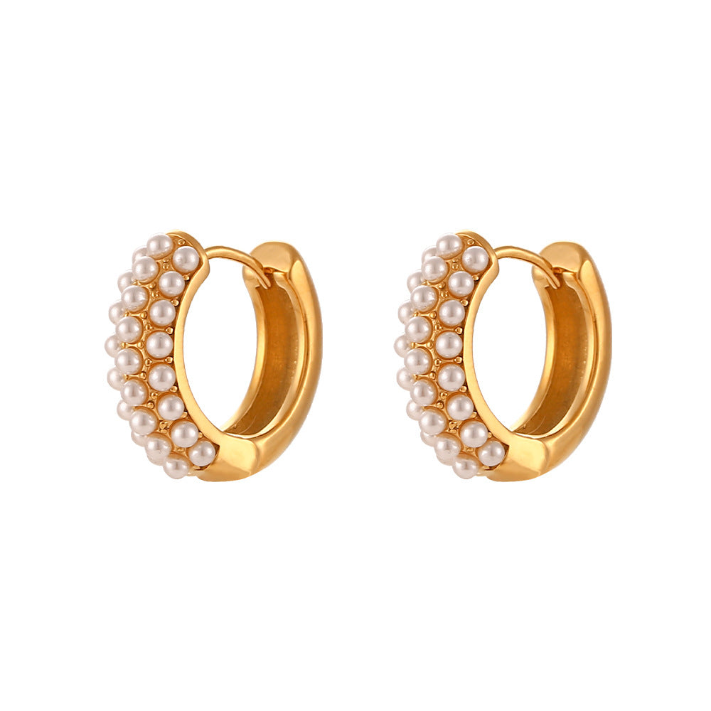 isolated front view of layered pearl-trimmed huggie earrings