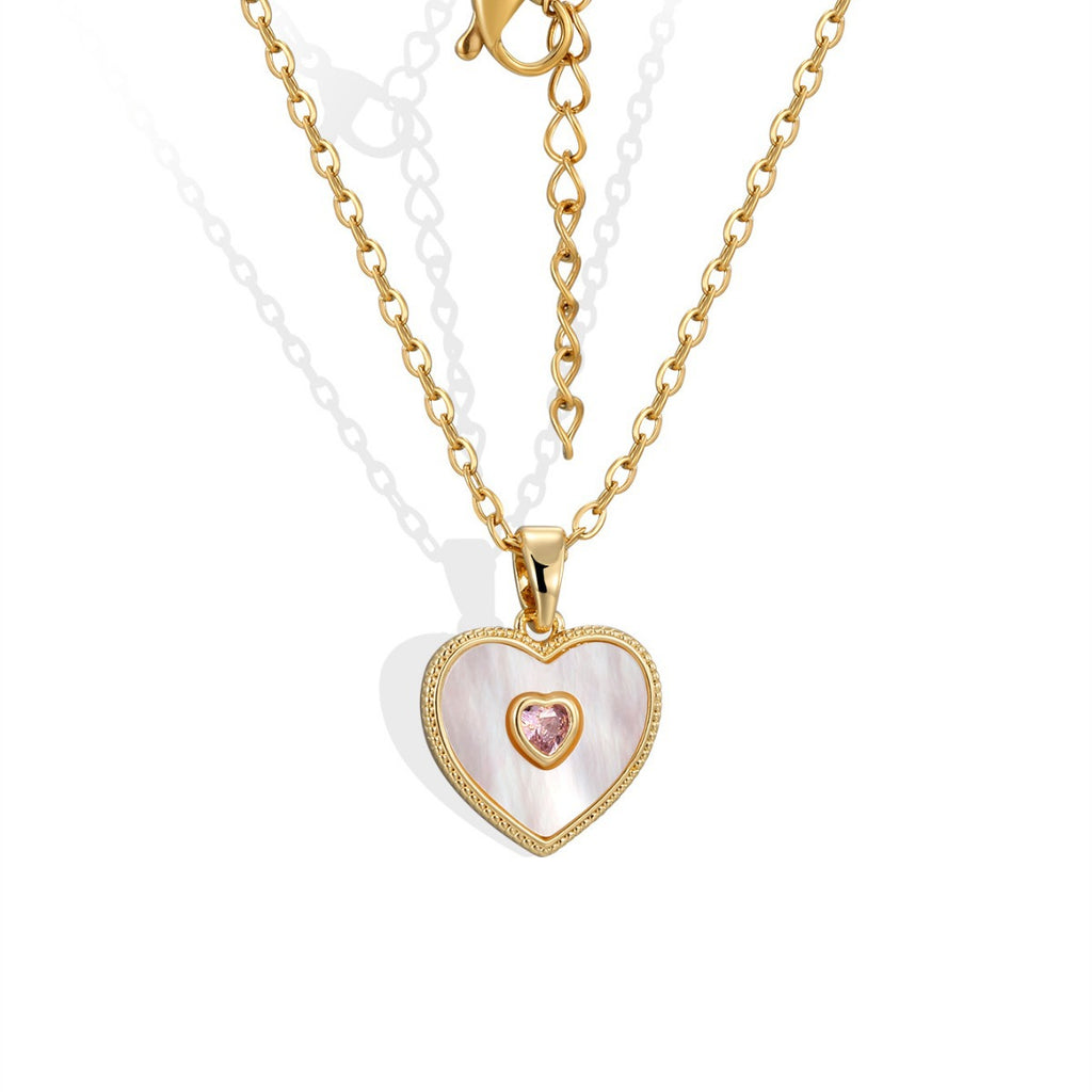 front view of iridescent heart pendant and pink center stone