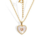 front view of iridescent heart pendant and pink center stone