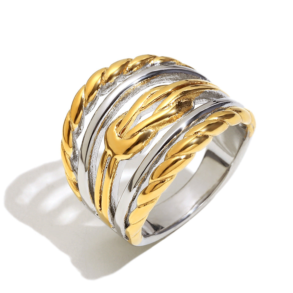 isolated two-tone statement ring with polished and rope-textured bands