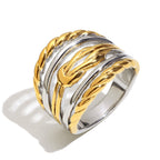 isolated two-tone statement ring with polished and rope-textured bands