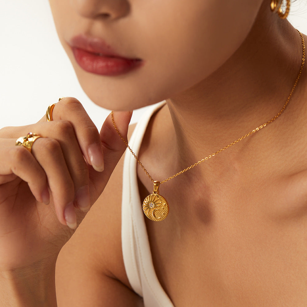 Round textured pendant necklace worn with separate earrings