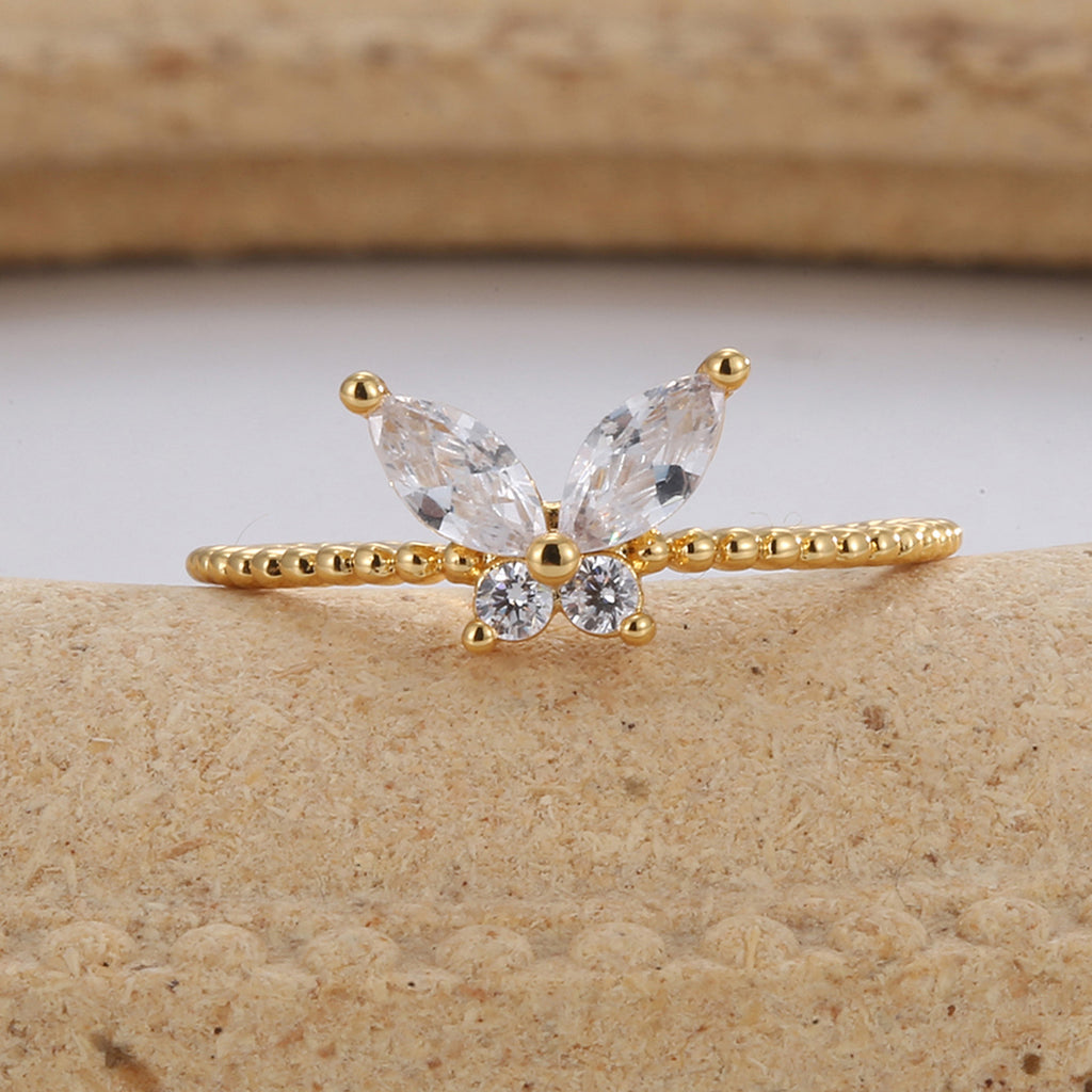 front view of marquise wings and round center stones