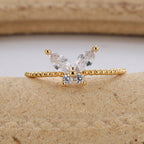 front view of marquise wings and round center stones