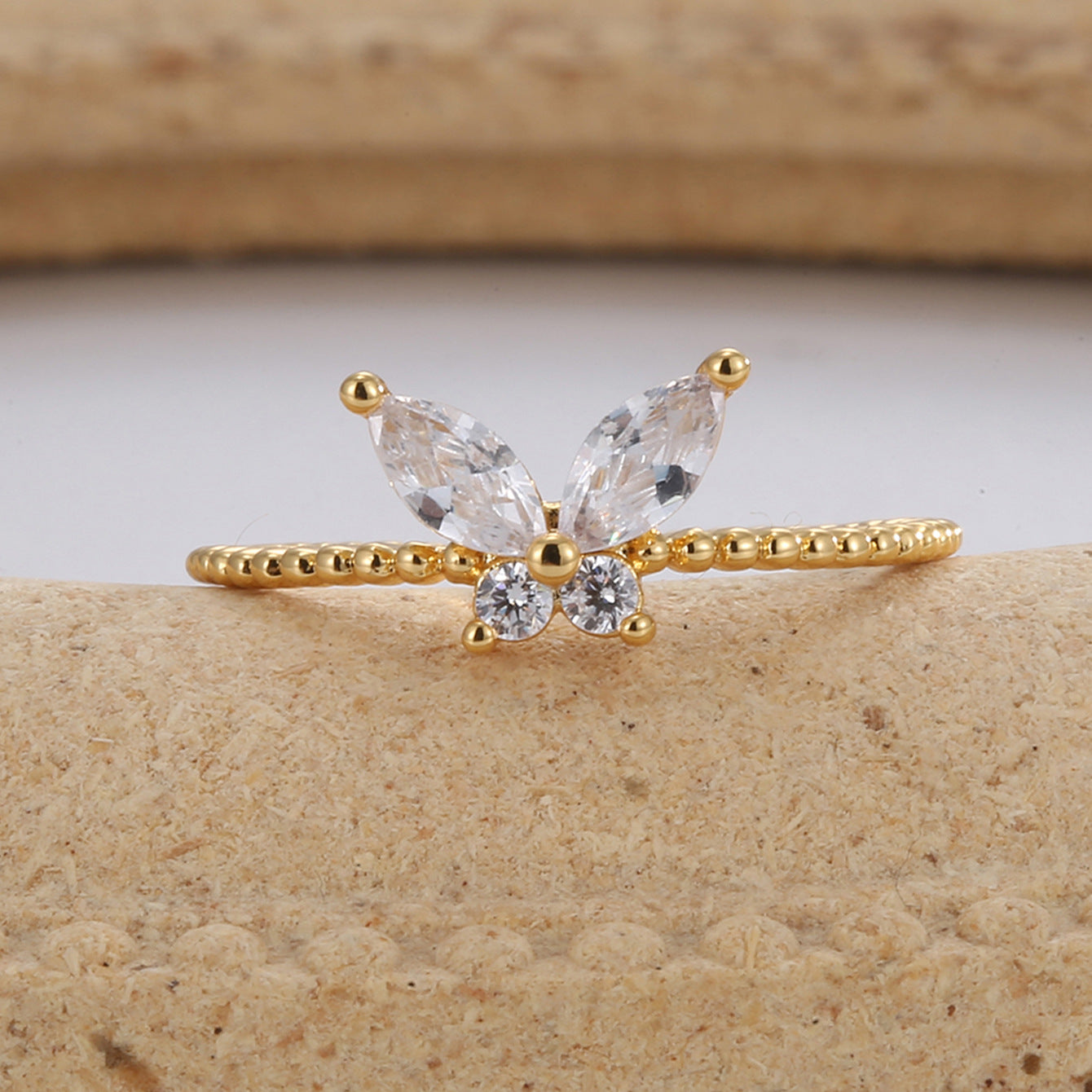 front view of marquise wings and round center stones