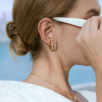 Geometric stone stud styled alongside another earring