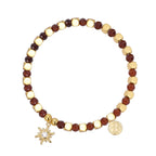 isolated faceted brown bead bracelet with clear-center sunburst charm