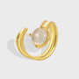 gold plated brass crescent ring with round milky cabochon