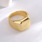 rear three-quarter view of broad gold plated signet ring