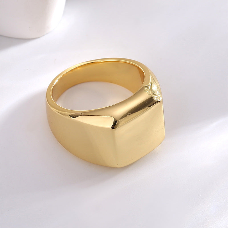rear three-quarter view of broad gold plated signet ring