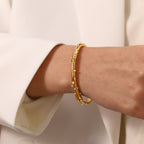 Gold Plated Stainless Steel Wavy Pearl and Clear Stone Cuff Bracelet — pearl accent close-up
