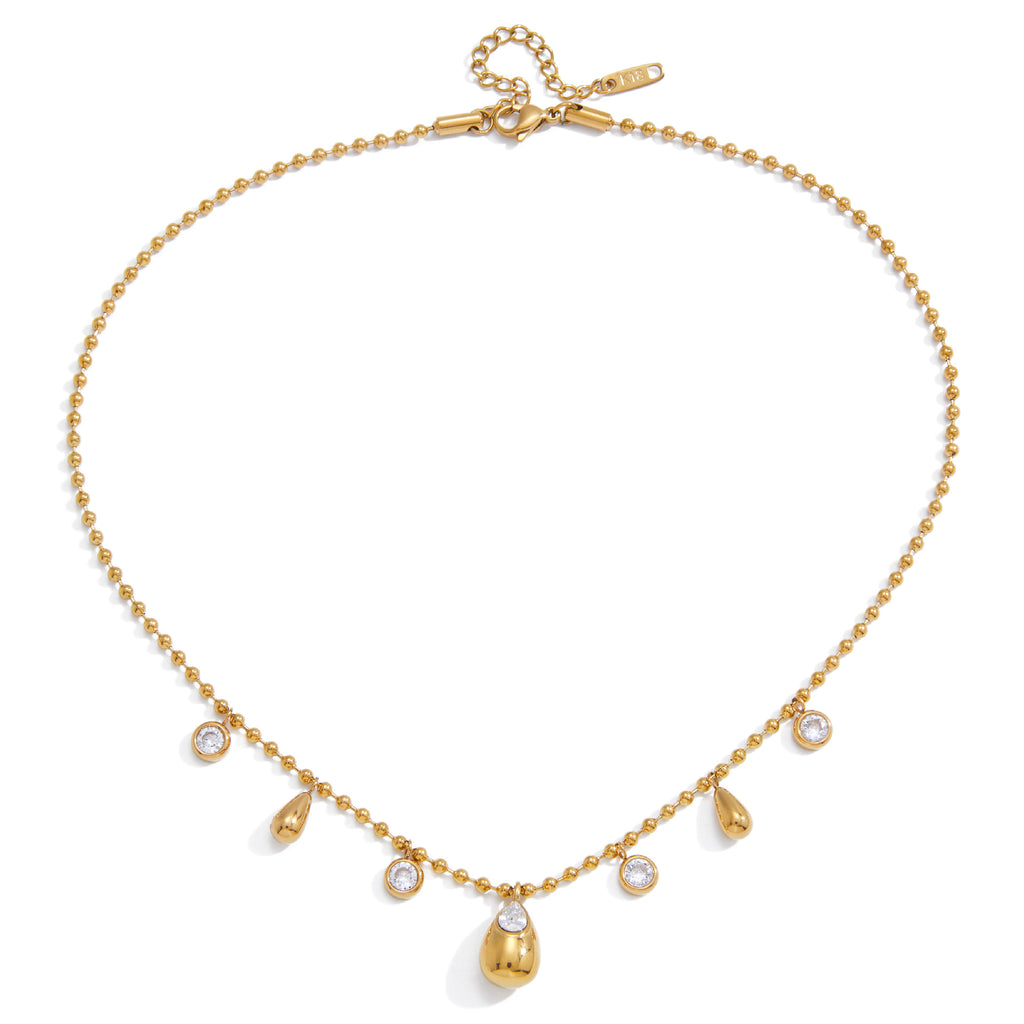 isolated teardrop charm necklace with round clear accents