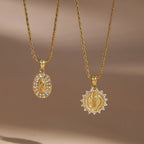 Clear-stone borders around oval and sunburst medallions
