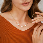 model wearing short shell pearl wave-link necklace