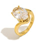 isolated gold plated oval clear-stone bypass ring