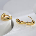 open view of gold plated brass heart huggie earrings