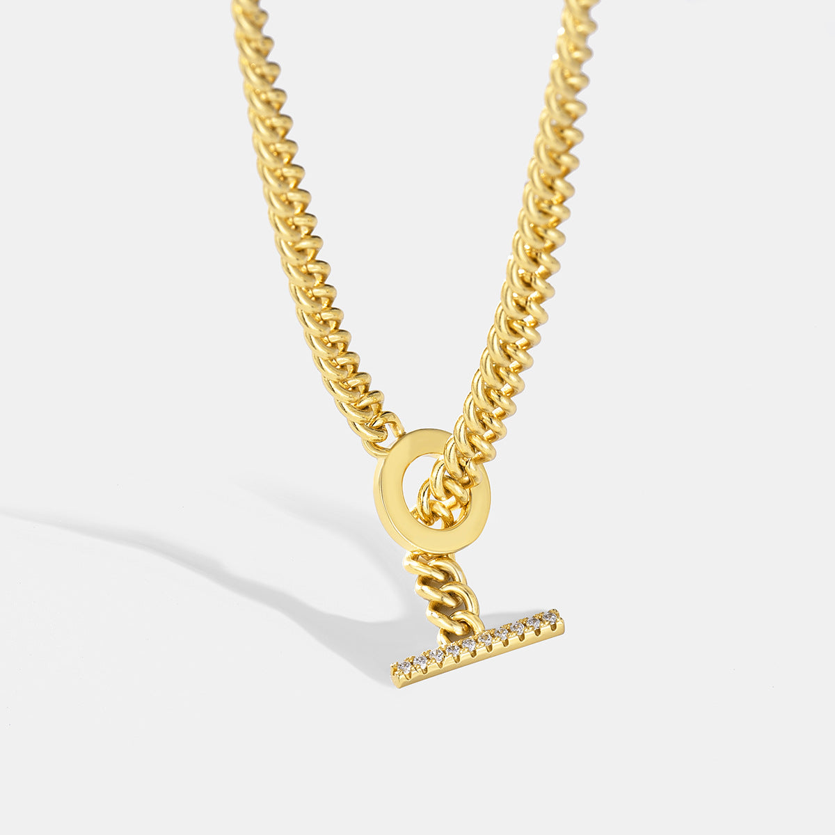 gold plated Cuban chain toggle necklace with a clear-stone T-bar