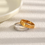 gold-tone and silver tone marine motif bands displayed together