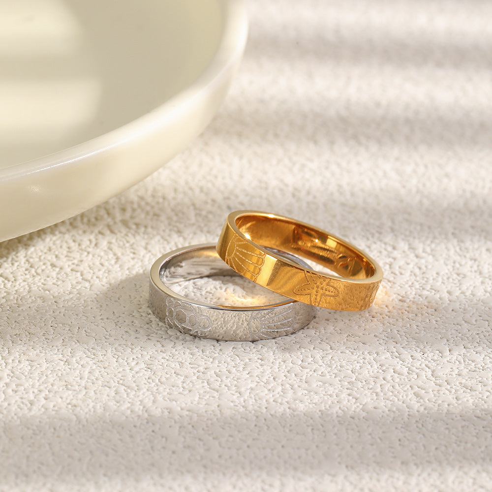 gold-tone and silver tone marine motif bands displayed together