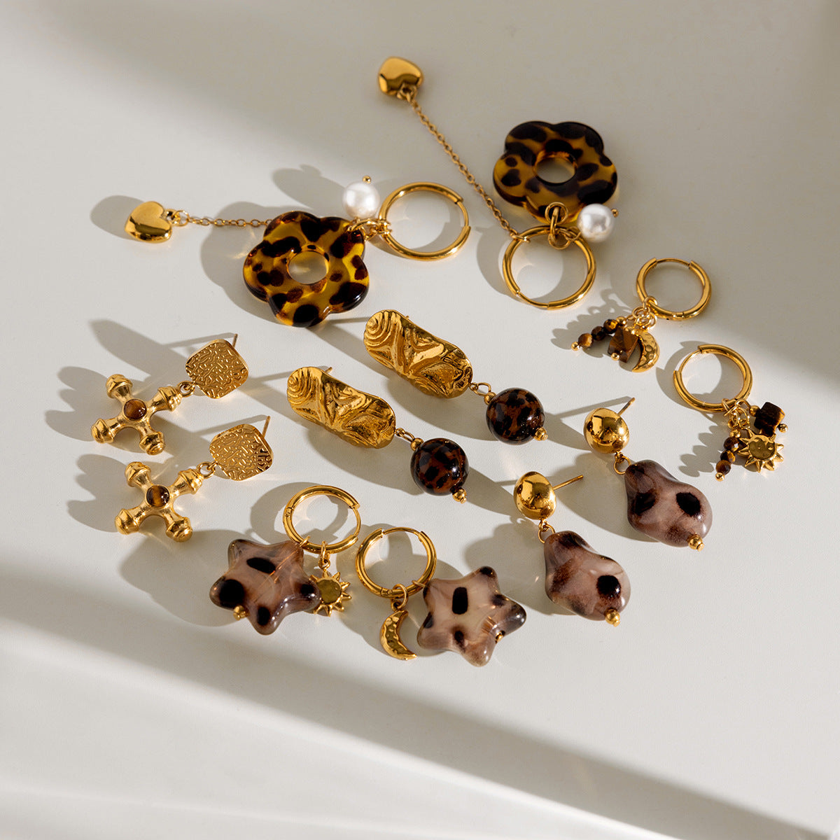 Stainless Steel Hoop and Drop Earring Collection shown on model
