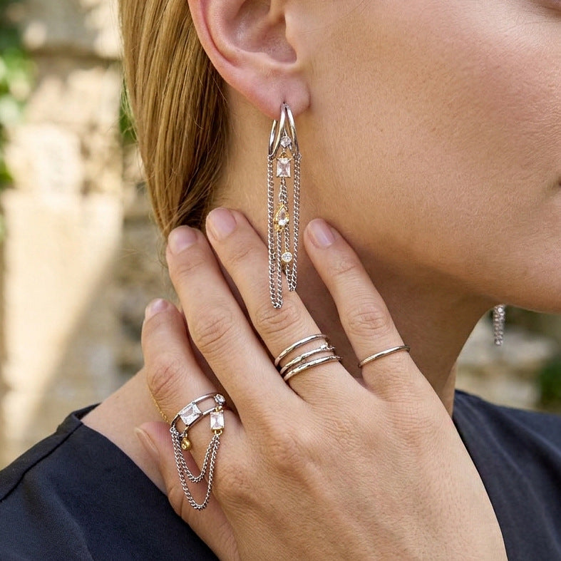Long chain drape earring and coordinating ring worn together