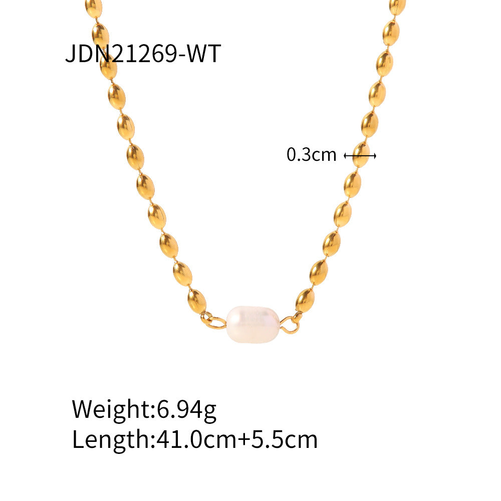 White bead accent necklace on gold-tone chain