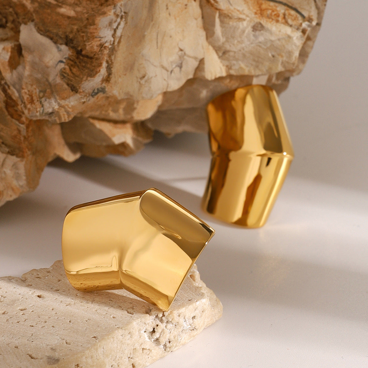 Folded Sculptural Stainless Steel Stud Earrings in Two Finishes styled product view