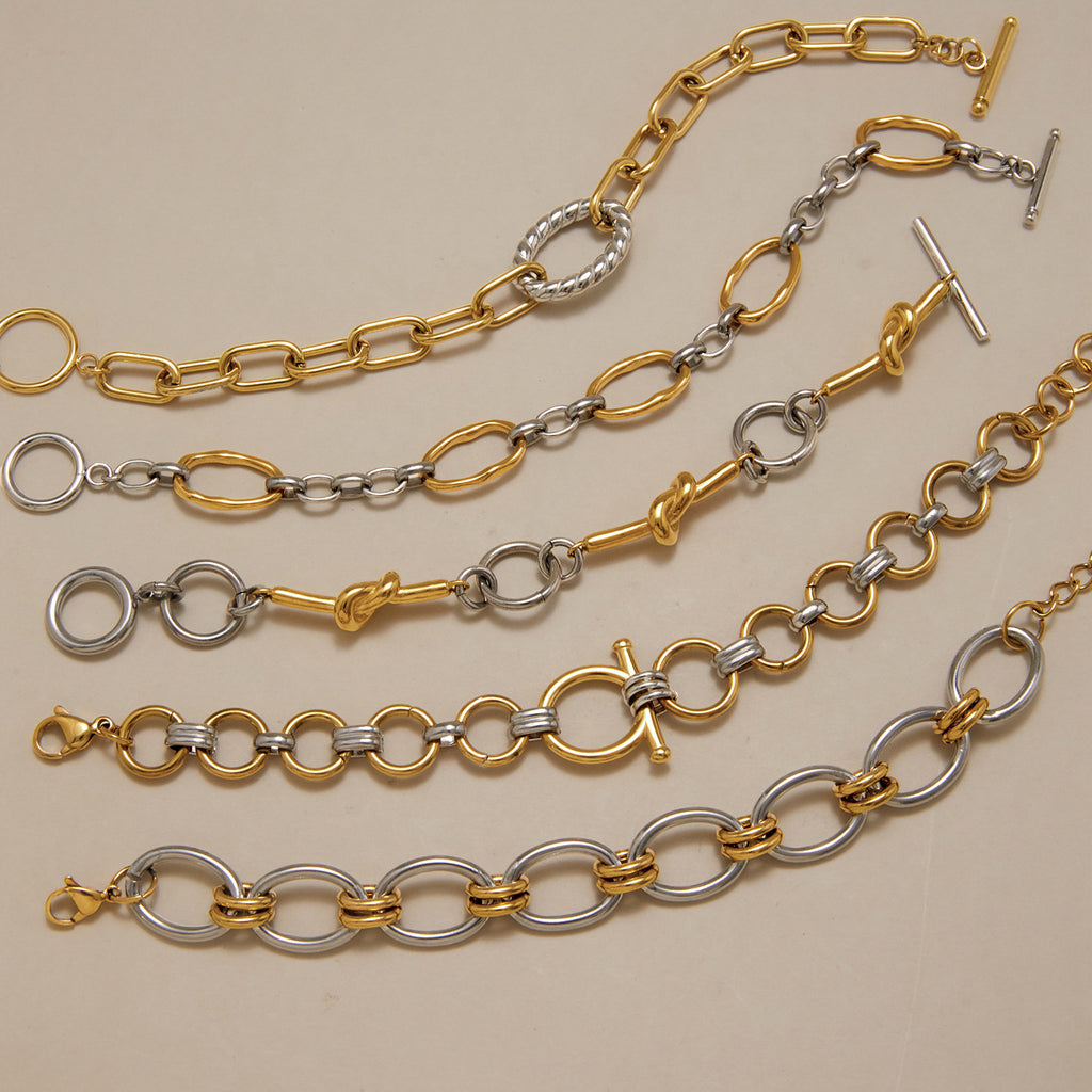 Five mixed-tone link bracelets arranged in rows