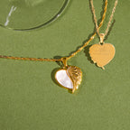 Front and engraved reverse of winged heart pendant