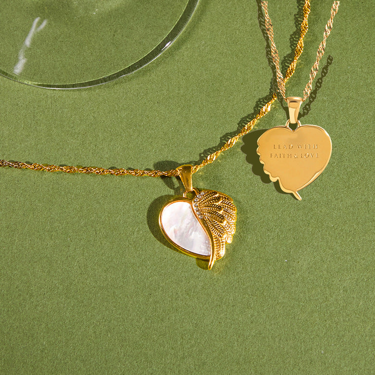 Front and engraved reverse of winged heart pendant